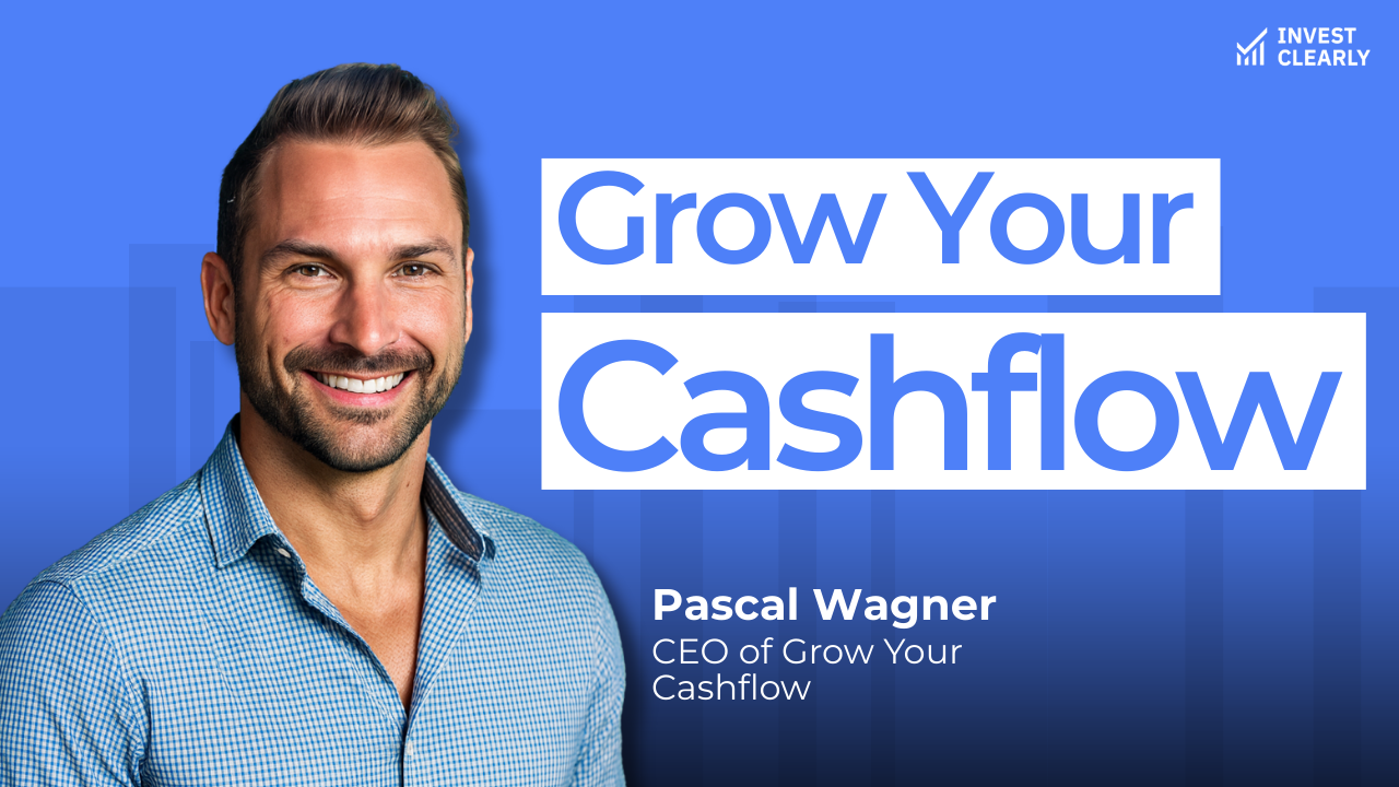 A promotional graphic for Invest Clearly featuring Pascal Wagner, CEO of Grow Your Cashflow. The text reads “Grow Your Cashflow.” Pascal is smiling and wearing a blue checkered button-down shirt against a blue gradient background with subtle geometric shapes and the Invest Clearly logo in the top left corner.